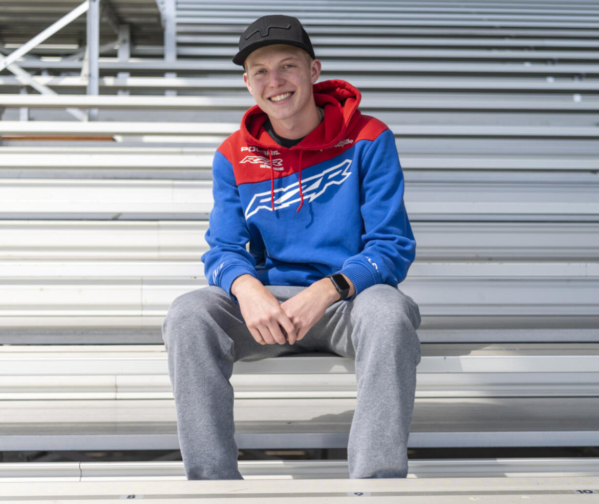 La Center junior Triston Martell poses for a portrait May 9 at La Center High School. One year ago, Triston went into sudden cardiac arrest at school and five staffers saved his life. Triston, who plays golf and basketball for La Center, now wears a pacemaker.