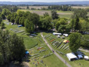 Rowing shells line the grass around Vancouver Lake on Friday during the U.S. Rowing Northwest Youth Championship Regatta at Vancouver Lake Park. The three-day event is expected to draw between 1,500 and 3,000 rowers over the course of the competition.