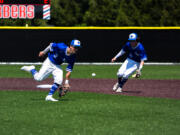 Branson Castleberry fields the ball in front of Caden Taylor during the first round of the 1A state playoffs vs Lynden Christian on May 20th, 2023 at Camas High School.