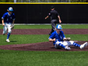 Garrett Maunu and Austin Aseph of LaCenter celebrate during the first round of the 1A state playoffs vs Lynden Christian on May 20th, 2023 at Camas High School.