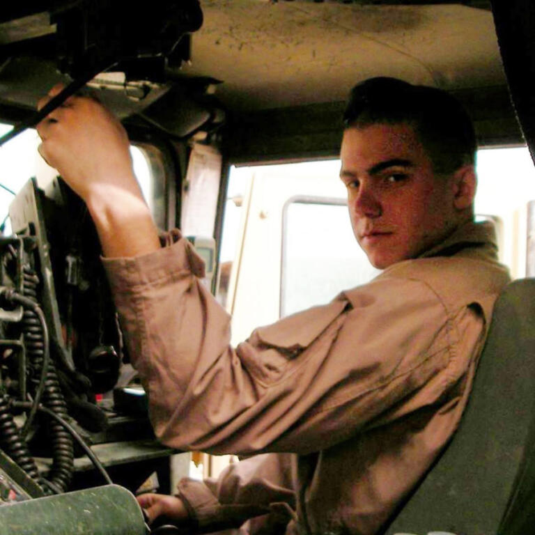 U.S. Marine Cpl. Julian Woodall in a vehicle during his service in the military. He died in May 2007 while in Iraq.
