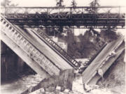 In early January 1956, heavy rains and melting snow supersaturated Clark County soil, creating landslides, washing out county roads, producing power outages and undermining the foundation of the Salmon Creek Bridge, causing it to collapse into a V-shape. The bridge failure halted Highway 99 travel in both directions until a temporary Bailey bridge from Fort Lewis restored traffic days later.