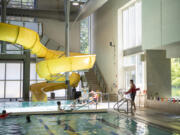 Lifeguard Keegan Amberg, right, watches over the pool at the Firstenburg Community Center in east Vancouver. The job market for teens this year is looking good, if not excellent, according to experts.