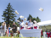 Dignitaries release white doves Monday during a Memorial Day ceremony at Fort Vancouver National Historic Site.