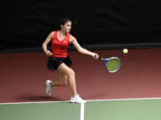 Hailey Kerker of Camas returns a shot during the singles championship match at the 4A District 4 girls tennis tournament at Club Green Meadows on Saturday, May, 13, 2023.