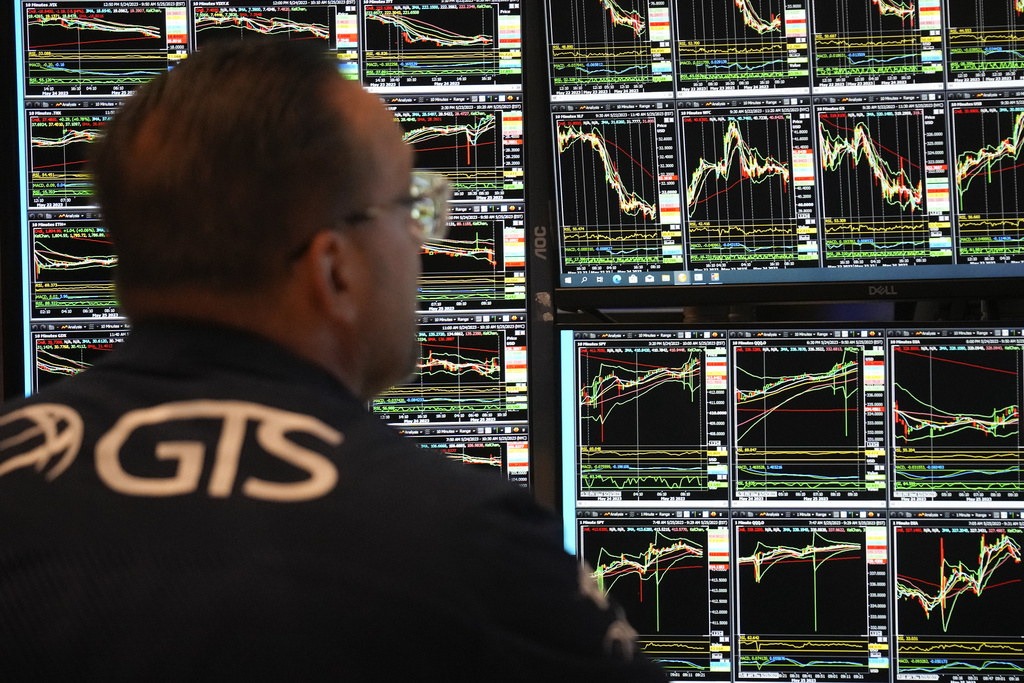 Traders work on the floor at the New York Stock Exchange in New York, Thursday, May 25, 2023.