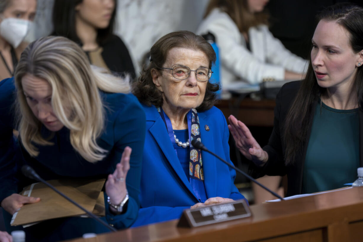 Sen. Dianne Feinstein, D-Calif., is flanked by aides as she returns to the Senate Judiciary Committee following a more than two-month absence as she was being treated for a case of shingles, at the Capitol in Washington, Thursday, May 11, 2023. Senate Judiciary Committee Chairman Dick Durbin, D-Ill., has been delayed in advancing many of President Joe Biden's judicial nominees because of the 89-year-old Feinstein's absence. (AP Photo/J.