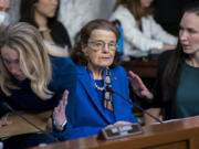 Sen. Dianne Feinstein, D-Calif., is flanked by aides as she returns to the Senate Judiciary Committee following a more than two-month absence as she was being treated for a case of shingles, at the Capitol in Washington, Thursday, May 11, 2023. Senate Judiciary Committee Chairman Dick Durbin, D-Ill., has been delayed in advancing many of President Joe Biden's judicial nominees because of the 89-year-old Feinstein's absence. (AP Photo/J.