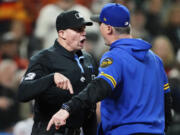 Home plate umpire Shane Livensparger argues with Seattle Mariners manager Scott Servais during the ninth inning of a baseball game against the Houston Astros, Friday, May 5, 2023, in Seattle. Servais was ejected.