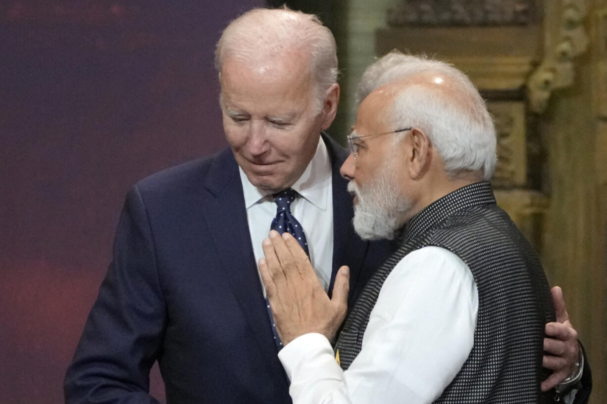 FILE - U.S. President Joe Biden, left, and India Prime Minister Narendra Modi talks during the G20 leaders summit in Nusa Dua, Bali, Indonesia, Nov. 15, 2022. Biden has made it a mission for the U.S. to build friendships overseas, and the next few weeks will offer a vivid demonstration of the importance he's placing on a relationship with Modi.