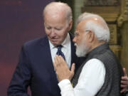 FILE - U.S. President Joe Biden, left, and India Prime Minister Narendra Modi talks during the G20 leaders summit in Nusa Dua, Bali, Indonesia, Nov. 15, 2022. Biden has made it a mission for the U.S. to build friendships overseas, and the next few weeks will offer a vivid demonstration of the importance he's placing on a relationship with Modi.