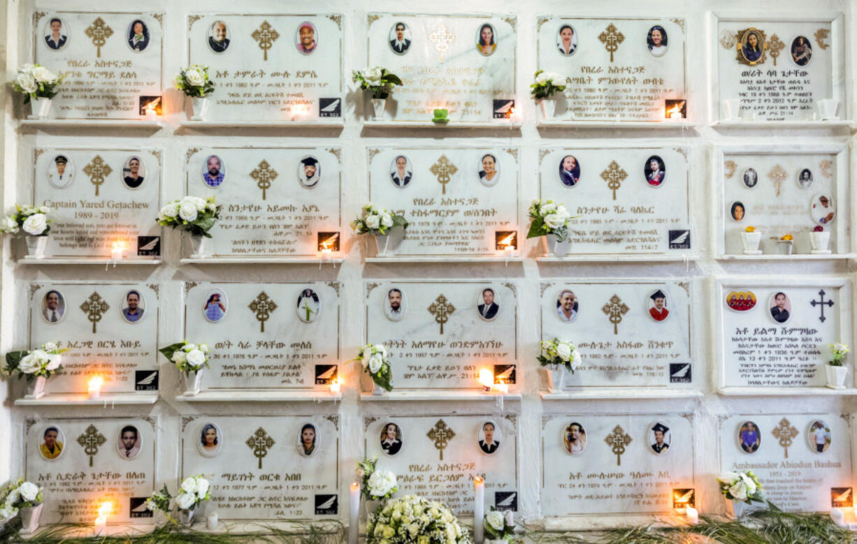 FILE - Candles are lit on a memorial wall during an anniversary memorial service at the Holy Trinity Cathedral in Addis Ababa, Ethiopia, March 8, 2020, to remember those who died when Ethiopian Airlines flight ET302, a Boeing 737 Max, crashed shortly after takeoff on March 10, 2019, killing all 157 on board. A federal judge is ruling that families of passengers who died in the crash can seek damages for the pain and terror suffered by their relatives before the plane crashed. The ruling posted Tuesday, May 30, 2023 is a setback for Boeing, which had argued that evidence about the victims' suffering is speculative and would have an unfair impact on jurors.