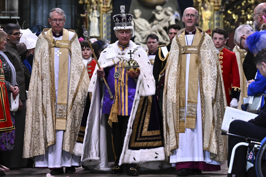 King Charles III crowned with regal pomp, cheers and shrugs - The