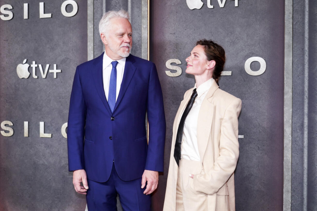 Actors Tim Robbins, left, and Rebecca Ferguson pose for photographers as they attend the premiere of Silo, in London, Tuesday, April 25, 2023.(Photo by Alberto Pezzali/Invision/AP) (Apple TV+)