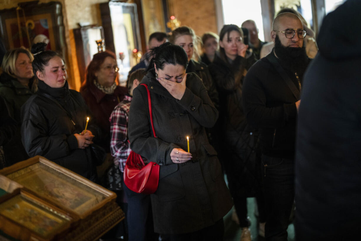 ++ CORRECTS AGES ++ A woman cries during the funeral of Sofia Shulha, 11, and Pysarev Kiriusha, 17, in Uman, central Ukraine, Sunday, April 30, 2023. Shulha and Kiriusha were killed during a Russian attack on a residential building early Friday morning.