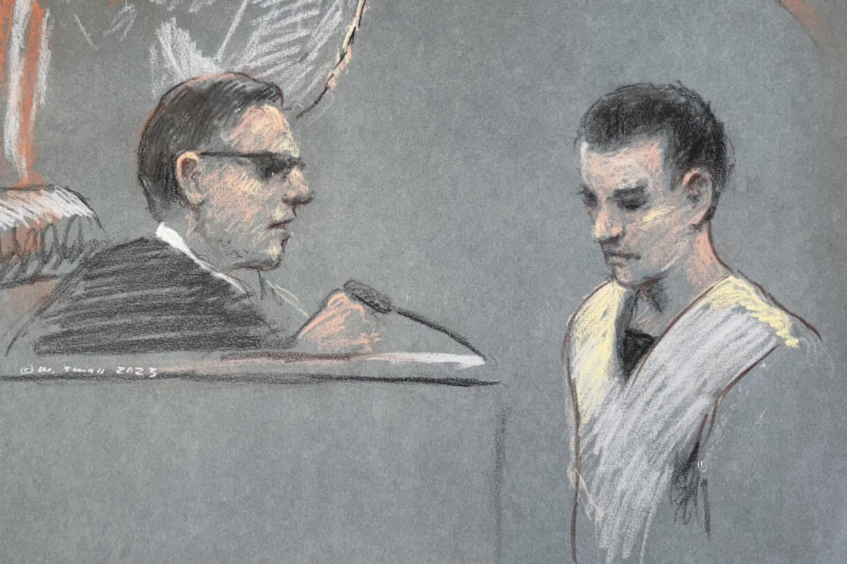 FILE - The artist sketch depicts Massachusetts Air National Guardsman Jack Teixeira, right, appearing in U.S. District Court in Boston, April 14, 2023. A bipartisan group of senators has introduced legislation that would require the National Archives to screen documents leaving the White House for classified material. It's the first major proposal to respond to a series of intelligence breaches over the last year.