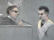 FILE - The artist sketch depicts Massachusetts Air National Guardsman Jack Teixeira, right, appearing in U.S. District Court in Boston, April 14, 2023. A bipartisan group of senators has introduced legislation that would require the National Archives to screen documents leaving the White House for classified material. It's the first major proposal to respond to a series of intelligence breaches over the last year.