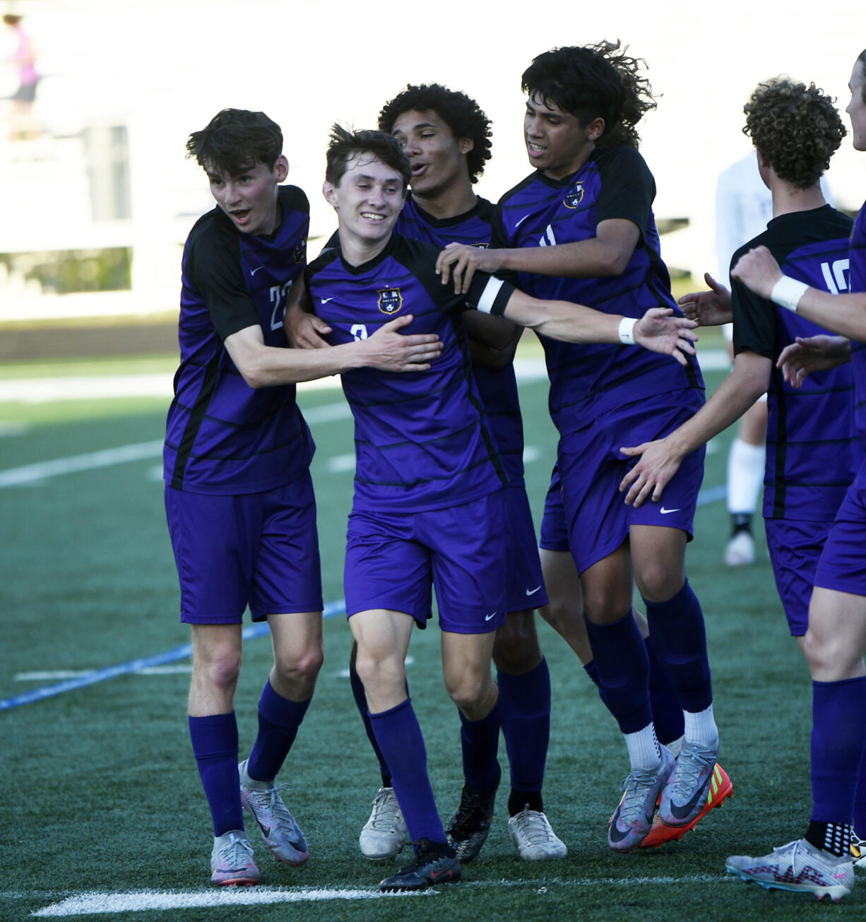 Columbia River players celebrate a goal by Alex Harris (center) during the Rapids' 3-0 win over Foster in a Class 2A boys soccer state first-round playoff game at Columbia River High School on Wednesday, May 17, 2023.