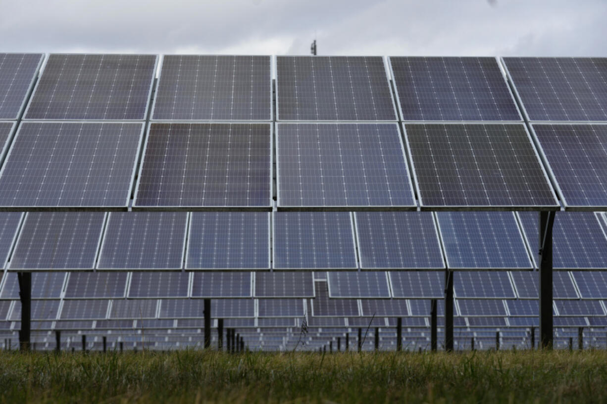 FILE - Solar panels work at the DTE O'Shea Solar Park in Detroit, Nov. 16, 2022. The House voted Friday, April 28, 2023, to reinstate tariffs on solar panel imports from several Southeast Asian countries after President Joe Biden paused them in a bid to boost the U.S. solar industry, a key part of his climate agenda.