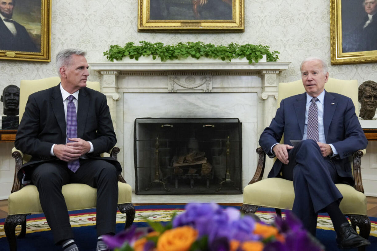 FILE - President Joe Biden meets with House Speaker Kevin McCarthy of Calif., to discuss the debt limit in the Oval Office of the White House, May 22, 2023, in Washington. The White House and congressional leaders are working to ensure passage in time to lift the nation's borrowing limit and prevent a U.S. default. The full House is expected to vote Wednesday. Officials say the U.S. risks default June 5.