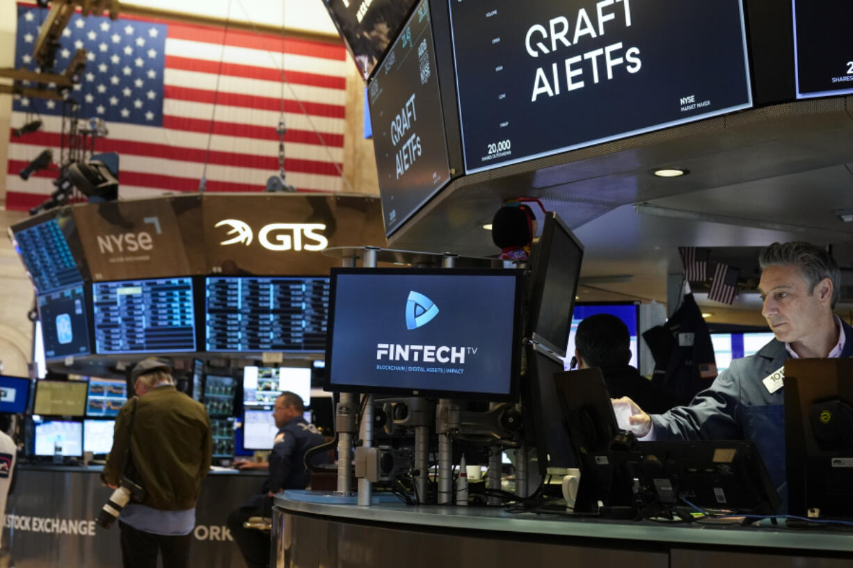 Traders work on the floor at the New York Stock Exchange in New York, Thursday, May 25, 2023.