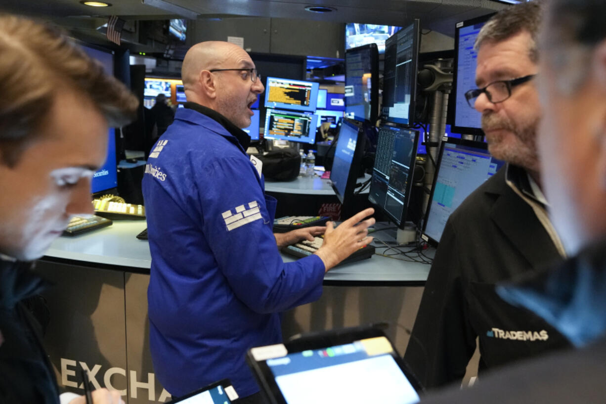 Traders work on the floor at the New York Stock Exchange in New York, Wednesday, May 3, 2023.  Stocks are drifting ahead of what Wall Street hopes will be the last hike to interest rates for a long time.