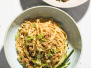 This image released by Milk Street shows a recipe for spicy pork and oyster sauce noodles.