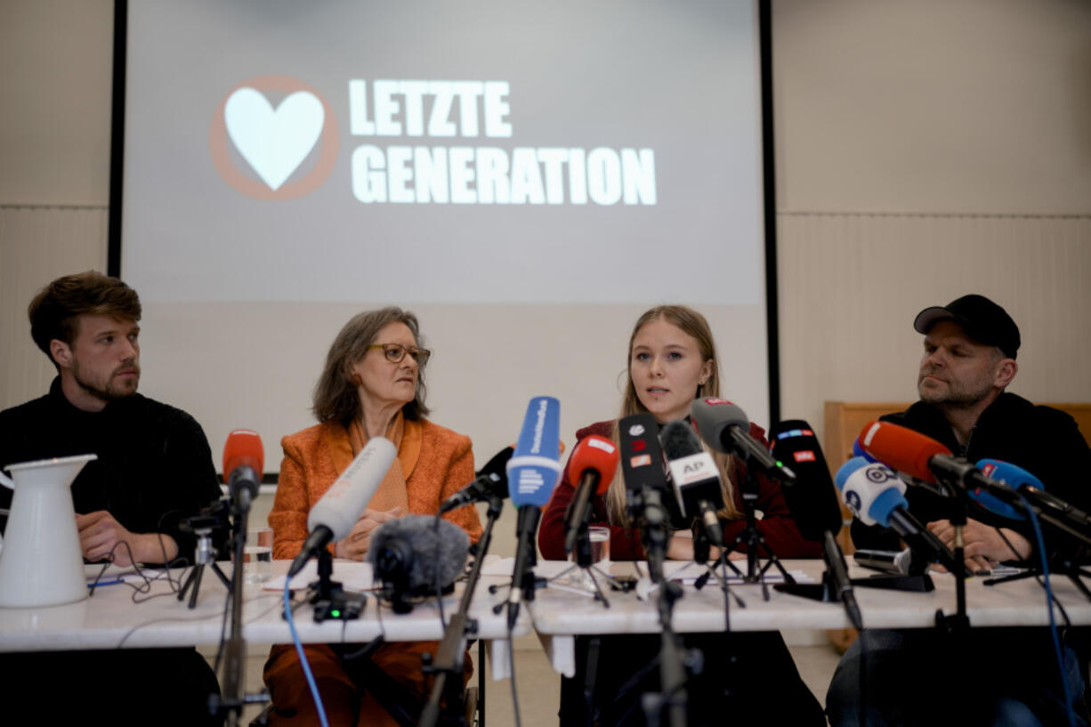 From right, Steve Rauhut, Aimee van Baalen, Marion Fabian and Joel Schmitt attend a news conference of the climate protest organization 'Letzte Generation' (Last Generation) in Berlin, Germany, Wednesday, May 24, 2023.
