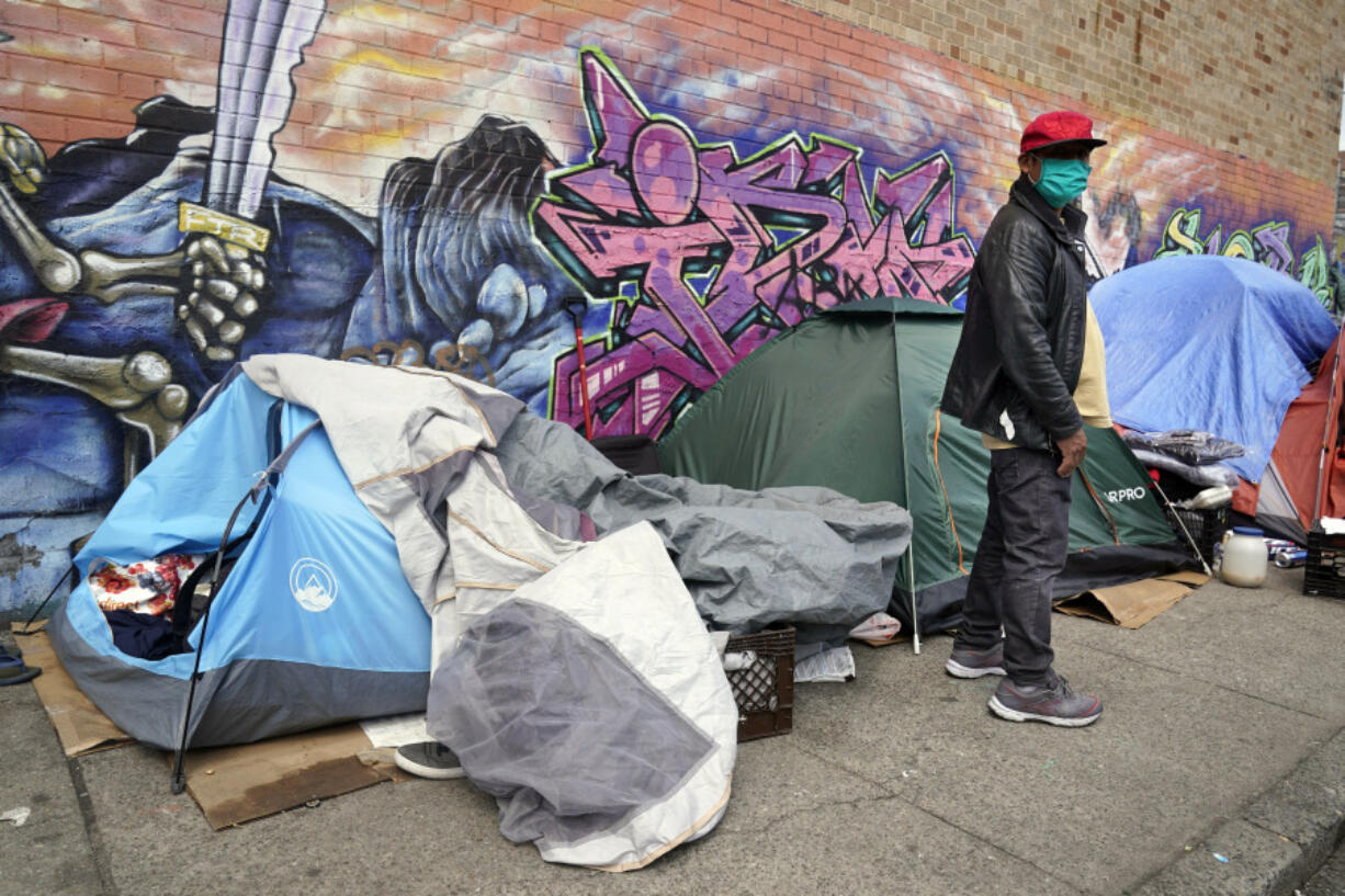 FILE - Sotero Cirilo stands near the tent where he sleeps next to other homeless people in the Queens borough of New York on April 14, 2021. The City Council unanimously approved a "Homeless Bill of Rights" in April 2023 that would make New York the first big U.S. city to establish an explicit right to sleep in at least some public places. If Mayor Eric Adams, a Democrat, allows the measure to become law, it could be a notable departure for the city -- which has for years sent police and sanitation crews to clear homeless encampments as they arise.