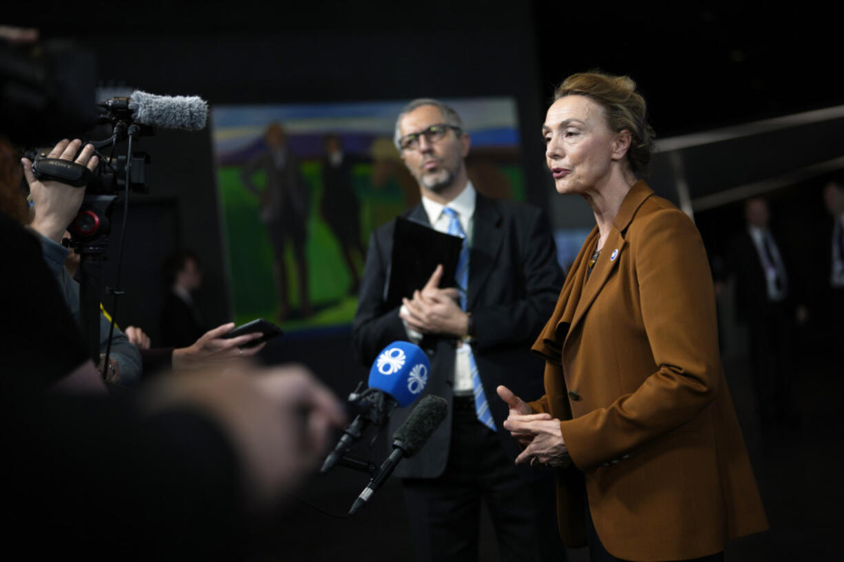 Council of Europe Secretary General Marija Pejcinovic Buric, center, speaks with the media at the Council of Europe summit in Reykjavik, Iceland, Wednesday, May 17, 2023. More than 40 countries at a summit of European leaders have backed a system to estimate the damage Russia is causing during the war in Ukraine, in the hopes Moscow can be forced to compensate victims and help rebuild the nation once the conflict is over.