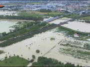 This photo provided by the Italian Carabinieri police shows flooded fields in the northern Italian region of Emilia Romagna, Wednesday, May 17, 2023. Unusually heavy rains have caused major floodings in Emilia Romagna, where trains were stopped and schools were closed in many towns while people were asked to leave the ground floors of their homes and to avoid going out.