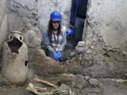 One of two skeletons that archaeologists believe were men who died when a wall collapsed on them during the powerful earthquakes that accompanied the eruption of Mount Vesuvius in 79 A.D.