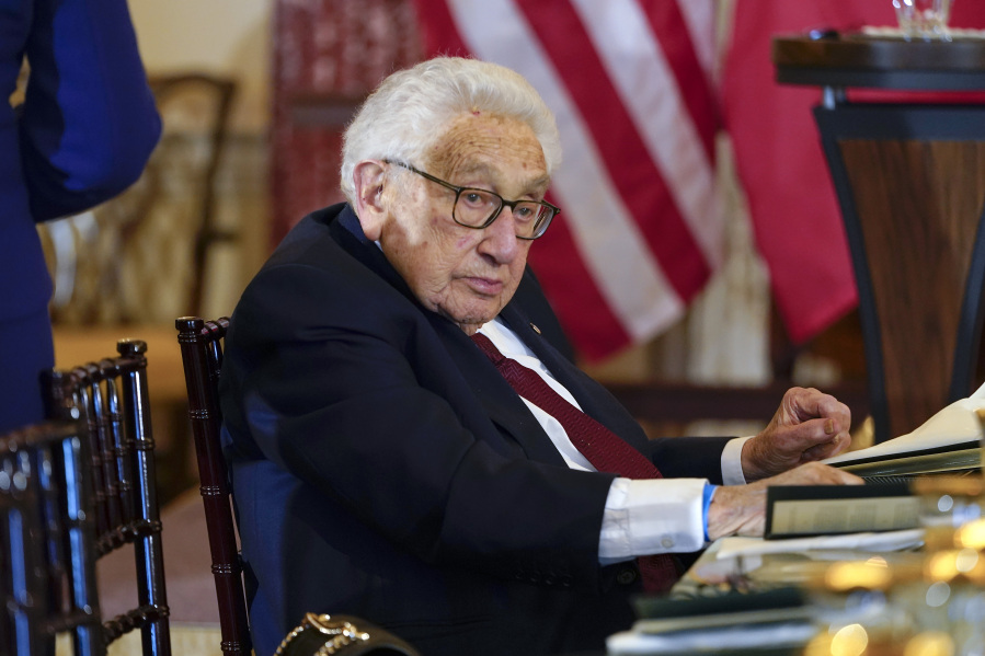 Former U.S. Secretary of State Henry Kissinger attends a luncheon with French President Emmanuel Macron, U.S. Vice President Kamala Harris and U.S. Secretary of State Antony Blinken on Dec. 1 at the State Department in Washington.