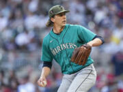 Seattle Mariners starting pitcher Logan Gilbert prepares to deliver in the first inning of a baseball game against the Atlanta Braves , Saturday, May 20, 2023, in Atlanta.