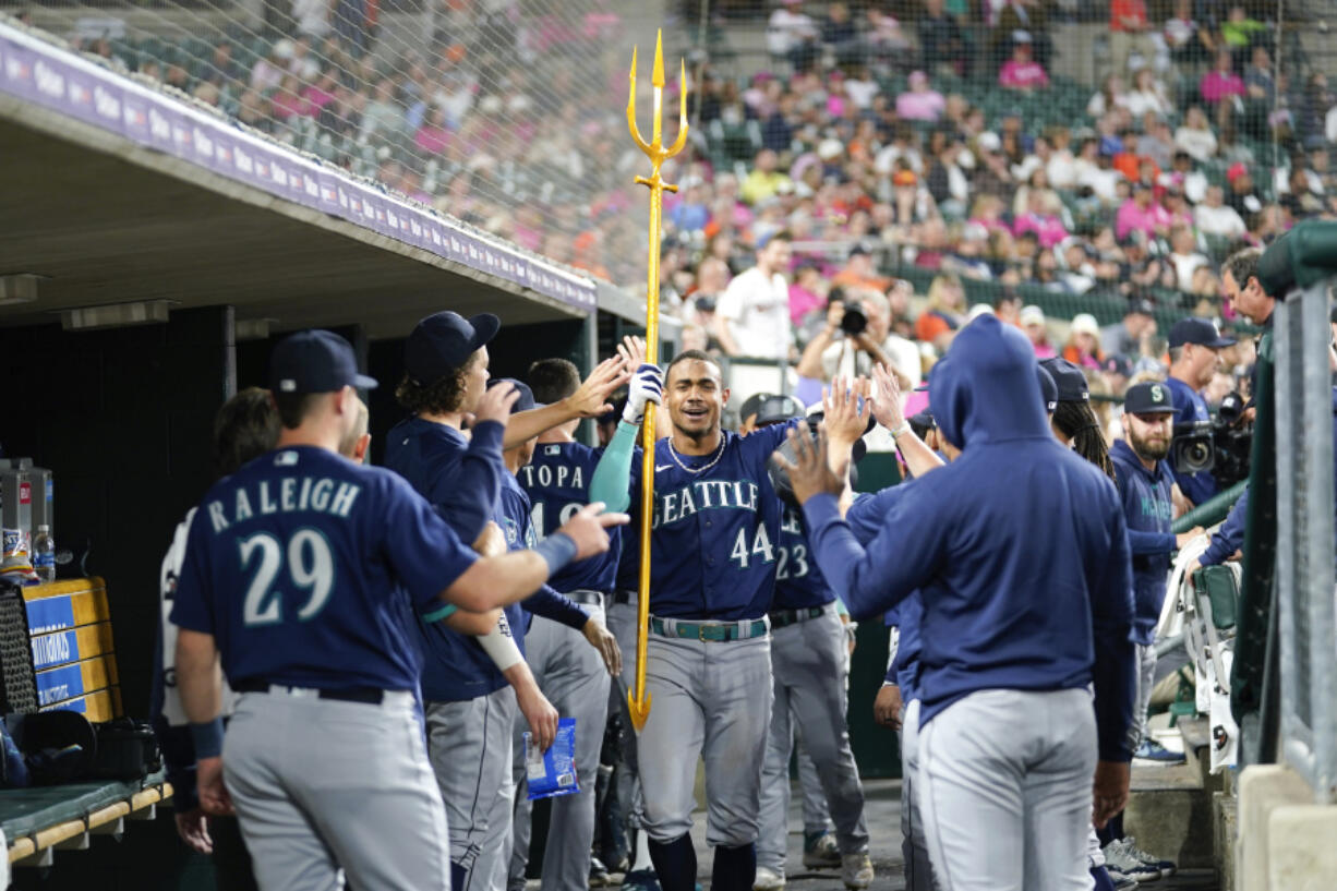 Seattle Mariners' Julio Rodriguez (44) celebrates his two-run home run against the Detroit Tigers in the ninth inning of a baseball game, Friday, May 12, 2023, in Detroit.