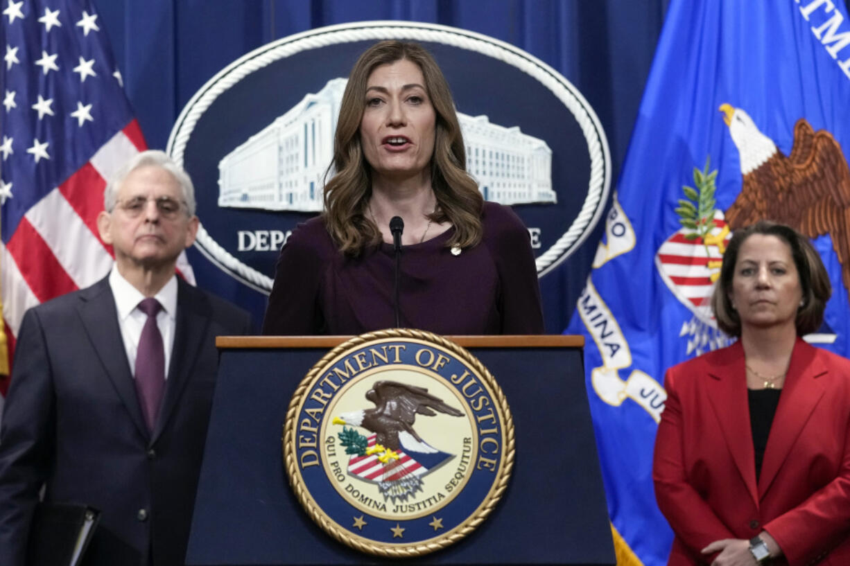 FILE - DEA Administrator Anne Milgram, center, flanked by Attorney General Merrick Garland, left, and Deputy Attorney General Lisa Monaco, right, speaks during a news conference at the Justice Department in Washington, Friday, April 14, 2023. Prosecutors revealed in a recent indictment that while Sinaloa cartel boss Joaqu?n "El Chapo" Guzm?n serves a life sentence, his sons have steered the family business into fentanyl, establishing a network of labs churning out massive quantities of the cheap, deadly drug that they smuggle into the U.S.