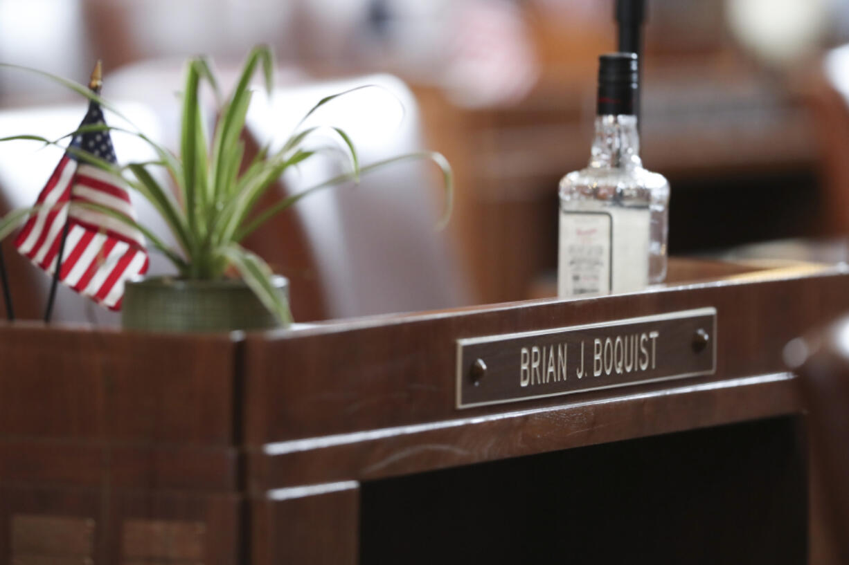 FILE - A desk in the Senate chambers belonging to Independent Sen. Brian Boquist is seen prior to a Senate session at the Oregon State Capitol in Salem, Ore., May 5, 2023. Sen. Boquist, along with four Republican senators, had unexcused absences for two prior days, preventing a quorum. Republicans and an independent senator in the Oregon Senate stretched a walkout Monday to 10 days, triggering a new constitutional provision that prohibits lawmakers with 10 or more unexcused absences from being reelected. The walkout that began May 3 has stalled action on hundreds of bills, including on gun control, gender-affirming care and abortion rights, as a deadline threatened to disqualify them from being reelected.