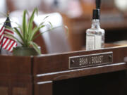 FILE - A desk in the Senate chambers belonging to Independent Sen. Brian Boquist is seen prior to a Senate session at the Oregon State Capitol in Salem, Ore., May 5, 2023. Sen. Boquist, along with four Republican senators, had unexcused absences for two prior days, preventing a quorum. Republicans and an independent senator in the Oregon Senate stretched a walkout Monday to 10 days, triggering a new constitutional provision that prohibits lawmakers with 10 or more unexcused absences from being reelected. The walkout that began May 3 has stalled action on hundreds of bills, including on gun control, gender-affirming care and abortion rights, as a deadline threatened to disqualify them from being reelected.