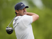 Brooks Koepka watches his tee shot on the ninth hole during the third round of the PGA Championship golf tournament at Oak Hill Country Club on Saturday, May 20, 2023, in Pittsford, N.Y.