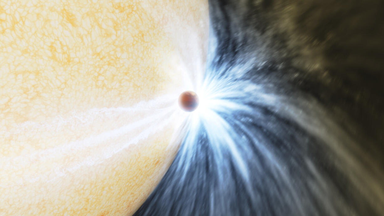 This illustration provided Caltech/IPAC by depicts a planet skimming the surface of its star. Astronomers reported their observations Wednesday, May 3, 2023, of what appears to be a gas giant at least the size of Jupiter being eaten by its star. The sun-like star had been puffing up with old age for eons and finally got so big that it engulfed the close-orbiting planet. (K. Miller, R.