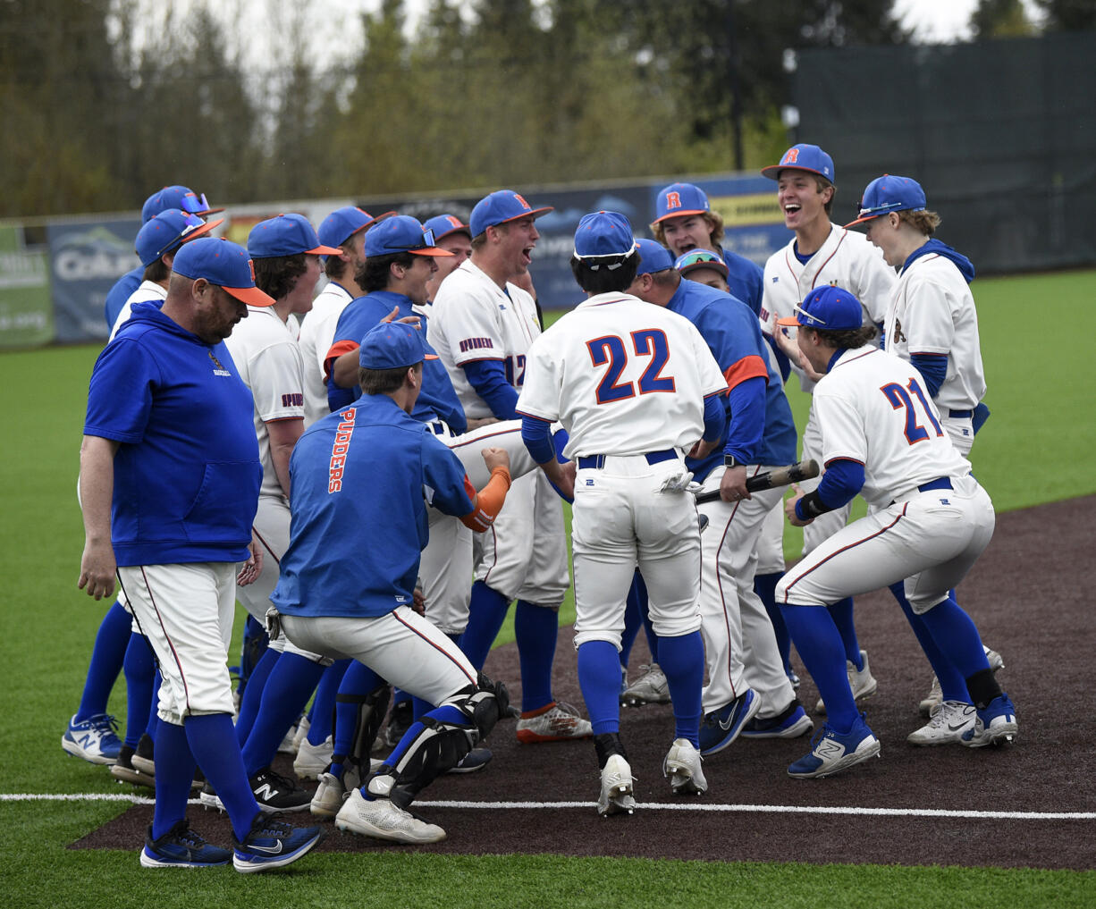 The members of the Ridgefield baseball team celebrate their 6-2 win over Mark Morris in a 2A Greater St. Helens League baseball game at the Ridgefield Outdoor Recreation Complex on Monday, May 1, 2023.