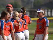 Ridgefield softball players embrace after the Class 2A state championship game against North Kitsap on Saturday in Selah. The Spudders' second-place finish was the second highest in program history.