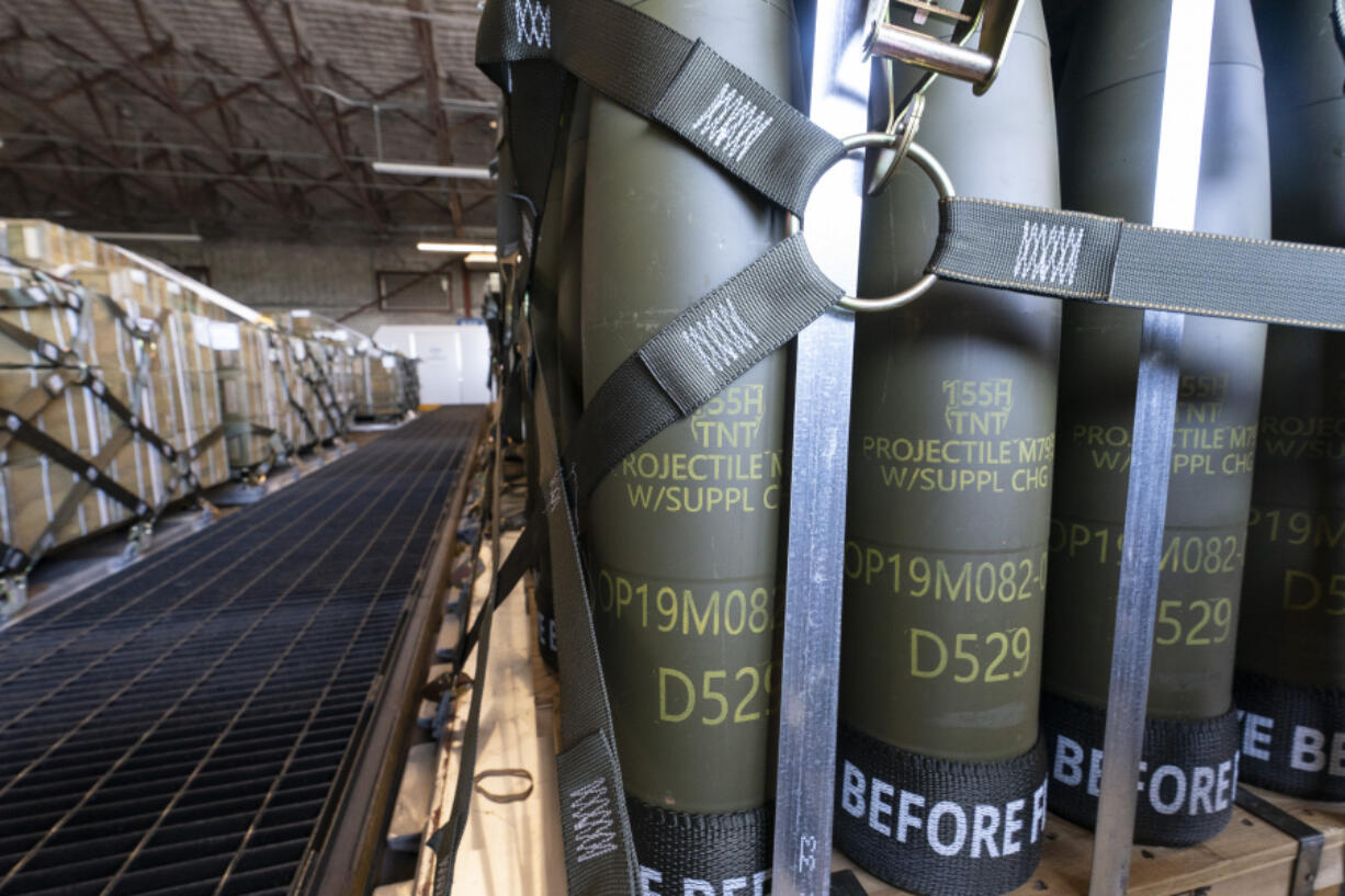 FILE - Pallets of 155 mm shells ultimately bound for Ukraine are loaded by the 436th Aerial Port Squadron, April 29, 2022, at Dover Air Force Base, Del. U.S. officials say a military aid package for Ukraine that is expected to be announced this week will total up to $300 million, and will include additional munitions for drones.