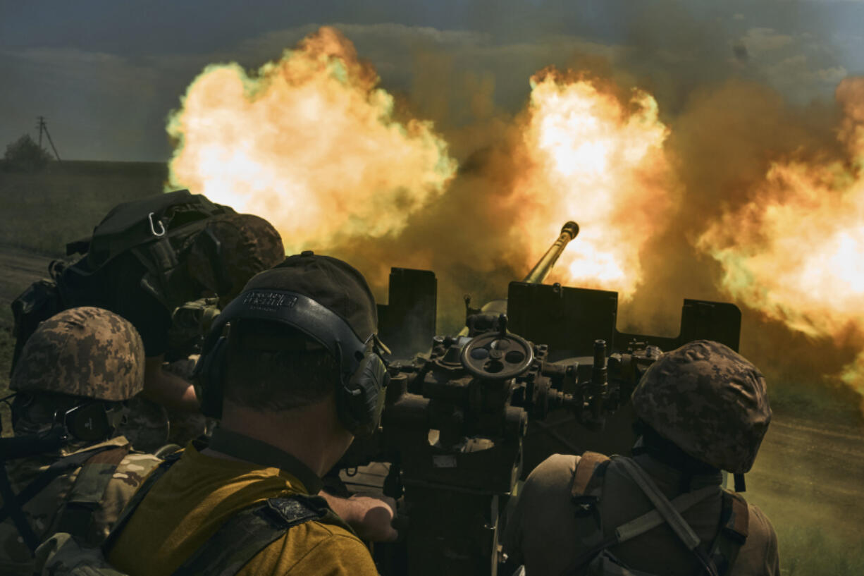 FILE - Ukrainian soldiers fire a cannon near Bakhmut, an eastern city where fierce battles against Russian forces have been taking place, in the Donetsk region, Ukraine, May 15, 2023. For months, Western allies have shipped billions of dollars worth of weapons systems and ammunition to Ukraine with an urgency to get the supplies to Kyiv in time for an anticipated spring counteroffensive. Now summer is just weeks away. While Russia and Ukraine are focused on an intense battle for Bakhmut, the Ukrainian spring offensive has yet to begin.