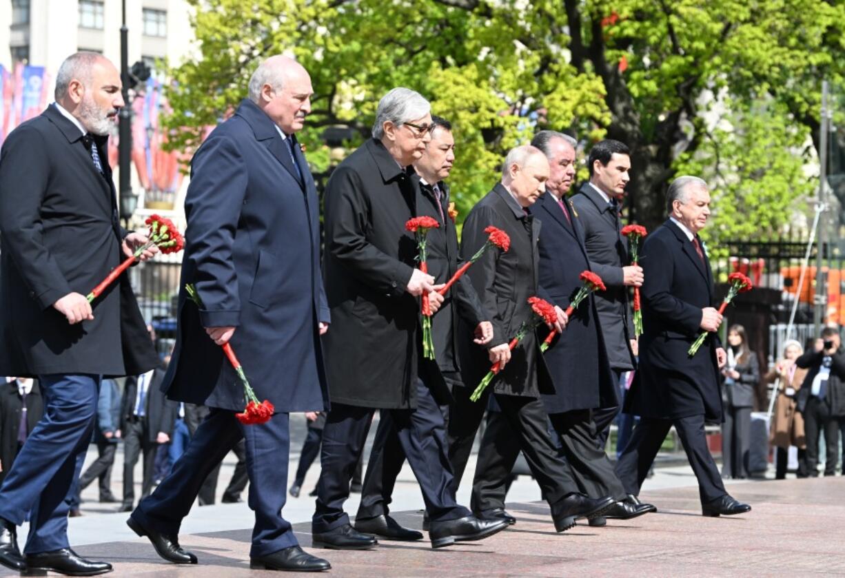 From left, Armenian Prime Minister Nikol Pashinyan, Belarusian President Alexander Lukashenko, Kazakhstan's President Kassym-Jomart Tokayev, Kyrgyzstan's President Sadyr Japarov, Russian President Vladimir Putin, Tajikistan's President Emomali Rahmon, Turkmenistan's President Serdar Berdimuhamedov and Uzbekistan's President Shavkat Mirziyoyev take part in a wreath-laying ceremony on Victory Day marking the 78th anniversary of the Victory over Nazi Germany in World War Two, at the Tomb of the Unknown Soldier at the Kremlin wall in Moscow, Russia, Tuesday, May 9, 2023.