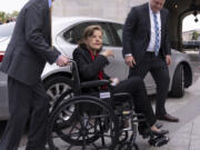 Sen. Dianne Feinstein, D-Calif., is assisted to a wheelchair by staff as she returns to the Senate after a more than two-month absence, at the Capitol in Washington, Wednesday, May 10, 2023. The 89-year-old California Democrat was out longer than expected which has slowed the push to confirm President Joe Biden's judicial nominees. (AP Photo/J.