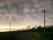 Mammatus clouds hover in the sky after a severe thunderstorm warning, Sunday, May 7, 2023, in Johnson County, Iowa.