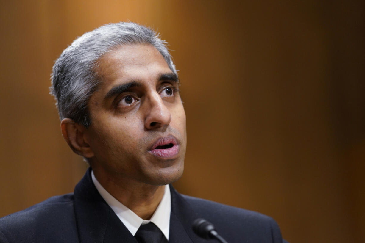 FILE - Surgeon General Dr. Vivek Murthy testifies before the Senate Finance Committee on Capitol Hill in Washington, on Feb. 8, 2022, on youth mental health care. Widespread loneliness in the U.S. is posing health risks as deadly as smoking a dozen cigarettes daily, costing the health industry billions of dollars annually, the U.S. surgeon general said Tuesday in declaring the latest public health epidemic. About half of U.S. adults say they've experienced loneliness, Murthy said in a new, 81-page report from his office.