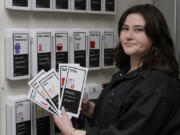 Abby Tow, a Sexual Health Peer Educator at the University of Oklahoma, displays some of the sexual health pamphlets available at the health center on campus, Wednesday, May 10, 2023, in Norman, Okla. Tow said she wonders if helicopter parenting has played a role in what she calls the "baby-fication of our generation".