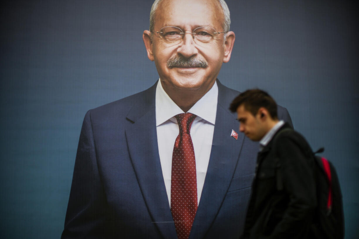 A man walks past a billboard of Turkish CHP party leader and Nation Alliance's presidential candidate Kemal Kilicdaroglu a day after the presidential election day, in Istanbul, Turkey, Monday, May 15, 2023. Turkey's presidential elections appeared to be heading toward a second-round runoff on Monday, with President Recep Tayyip Erdogan, who has ruled his country with a firm grip for 20 years, leading over his chief challenger, but falling short of the votes needed for an outright win.